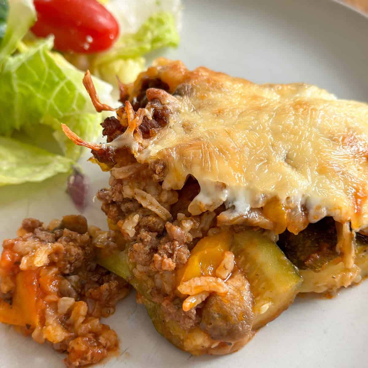 Stuffed zucchini with ground beef and rice.