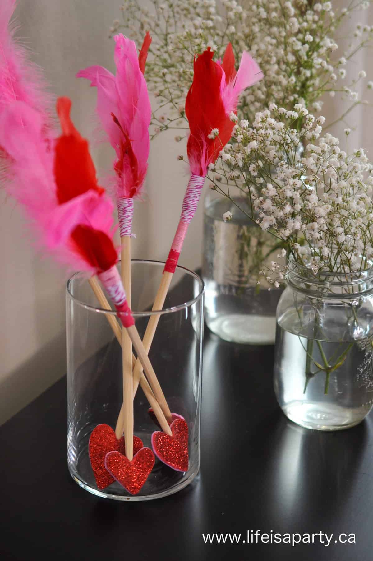 Valentine's Day arrow craft made with chopsticks.