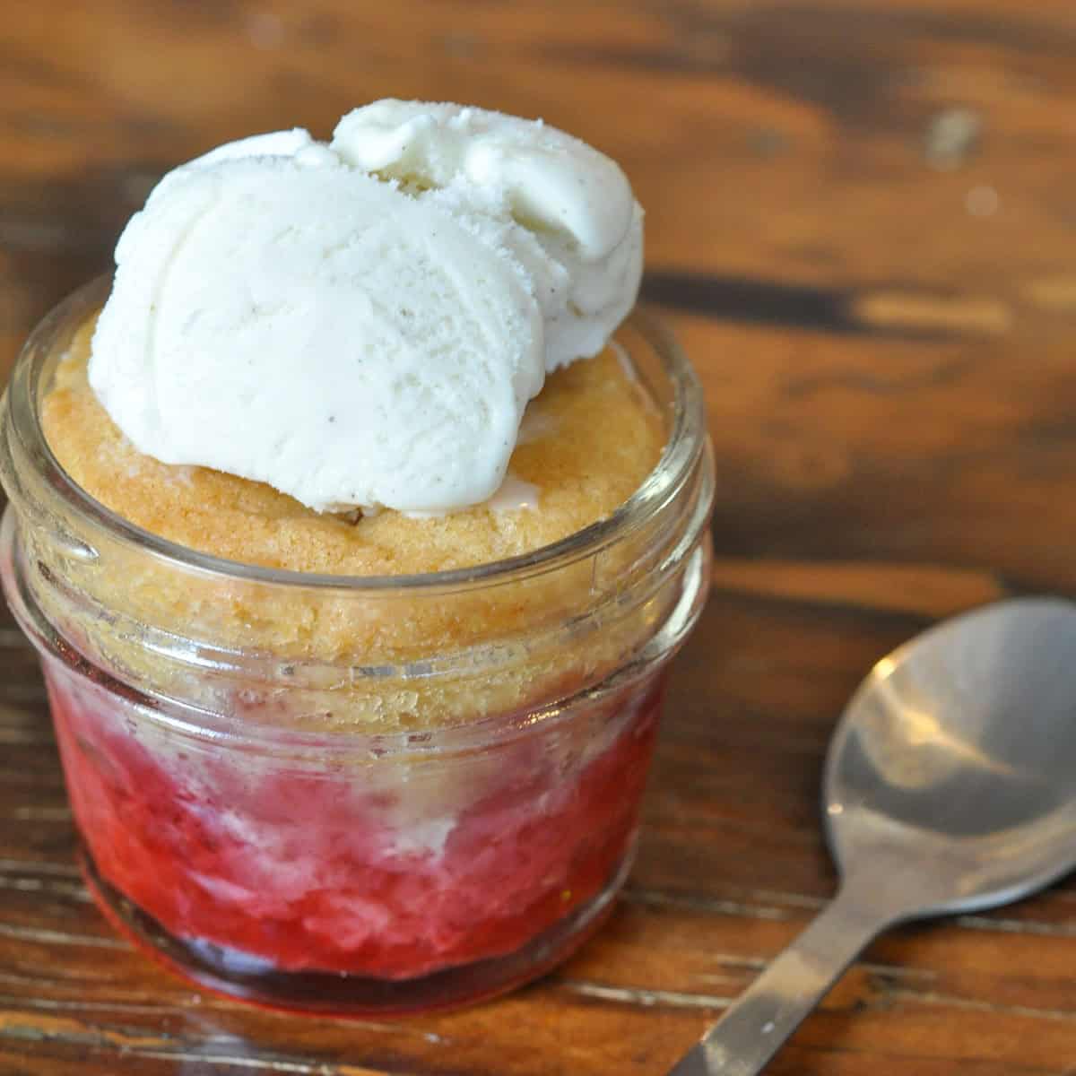 Strawberry cobbler in a mason jar.