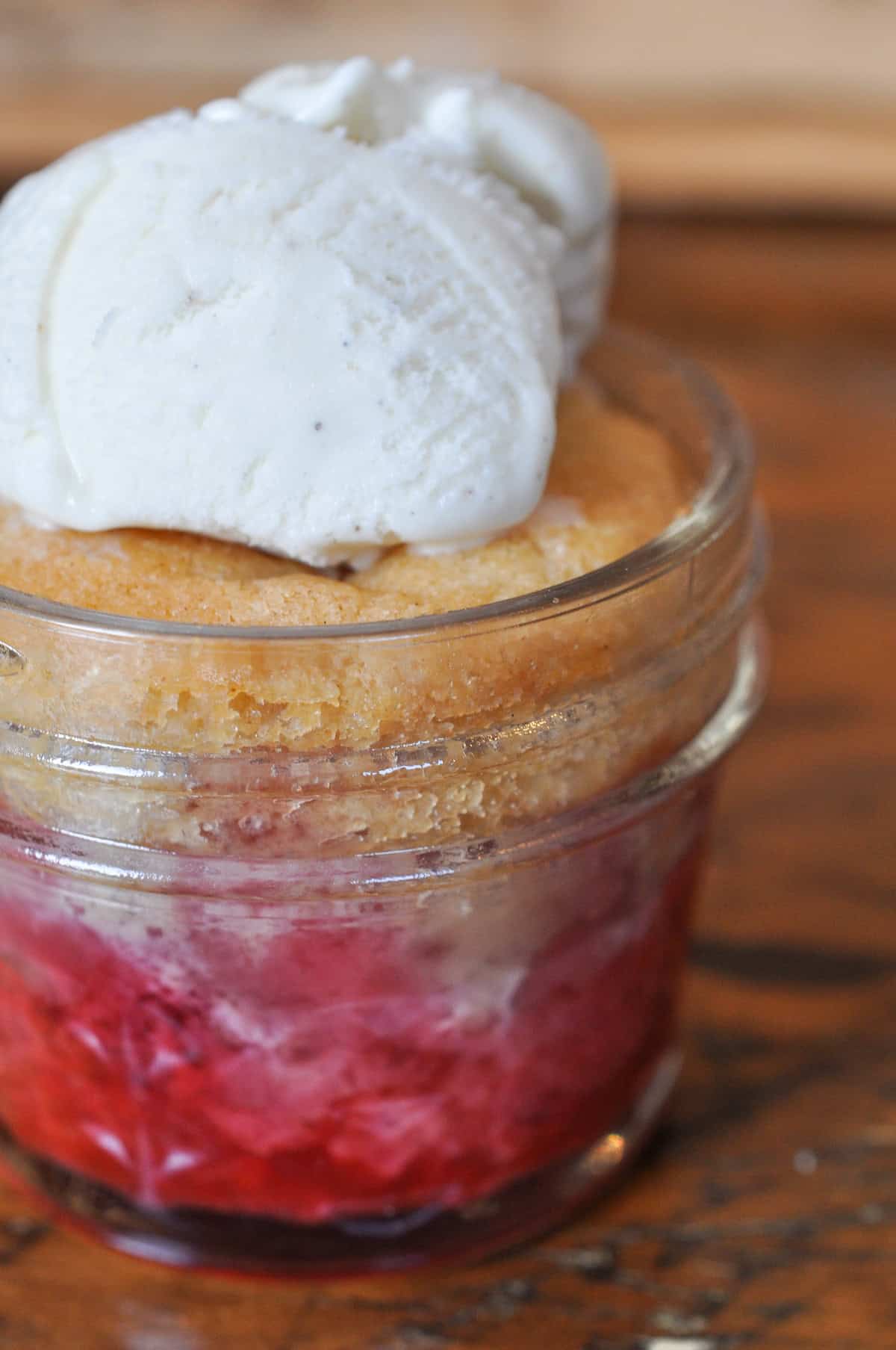 Strawberry cobbler in a mason jar.