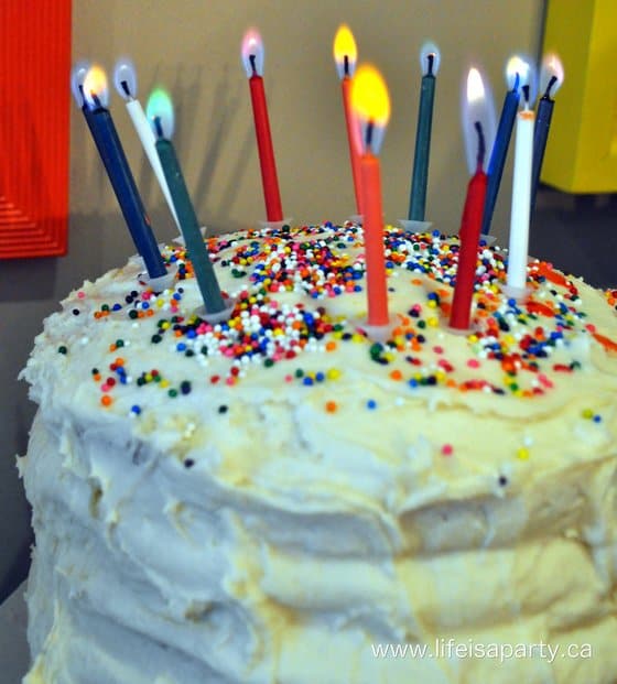 rainbow birthday cake with candles.