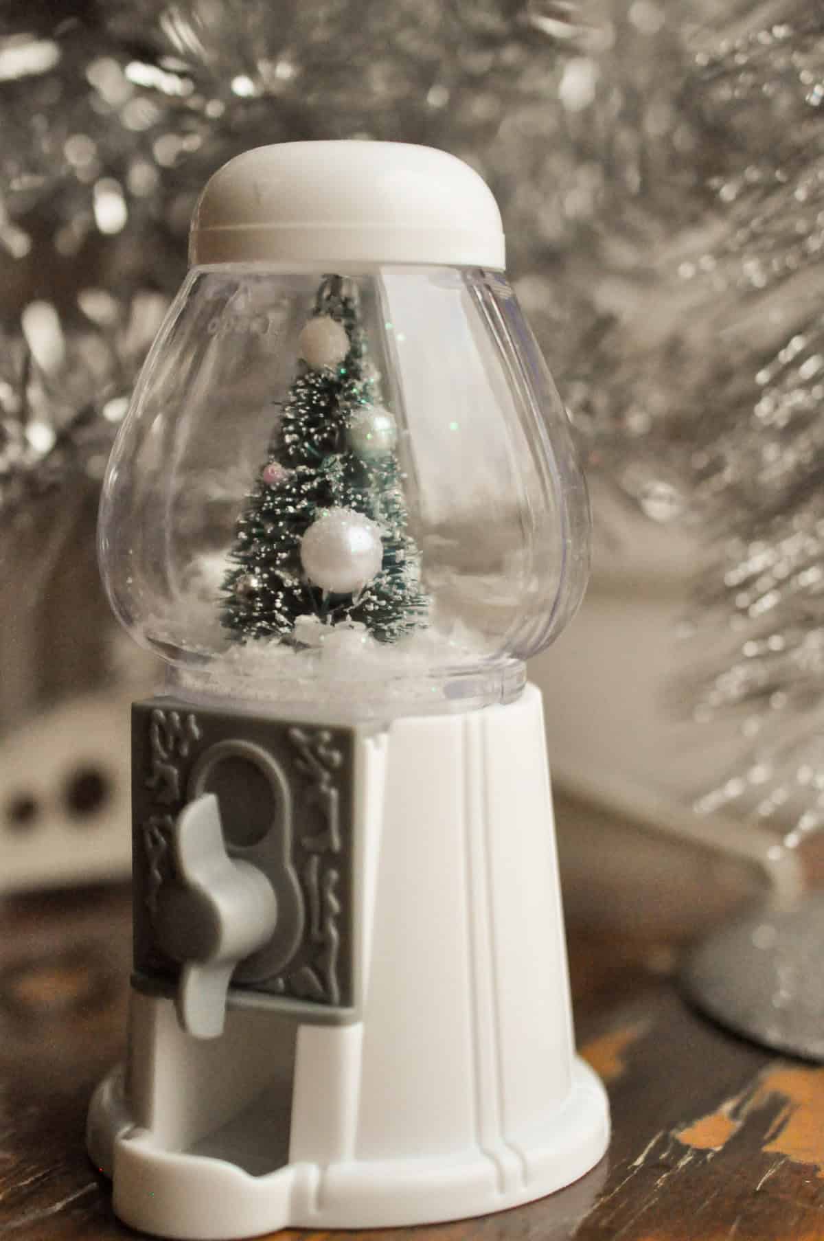 Turn a gum ball machine into a DIY snow globe.