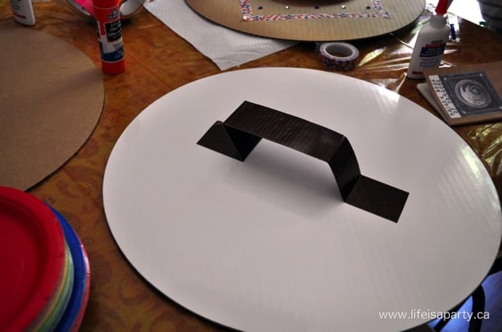 How To Train Your Dragon Birthday Party: Make your own shield, train your dragon stations, sensory table, and dragon training survival loot bags!