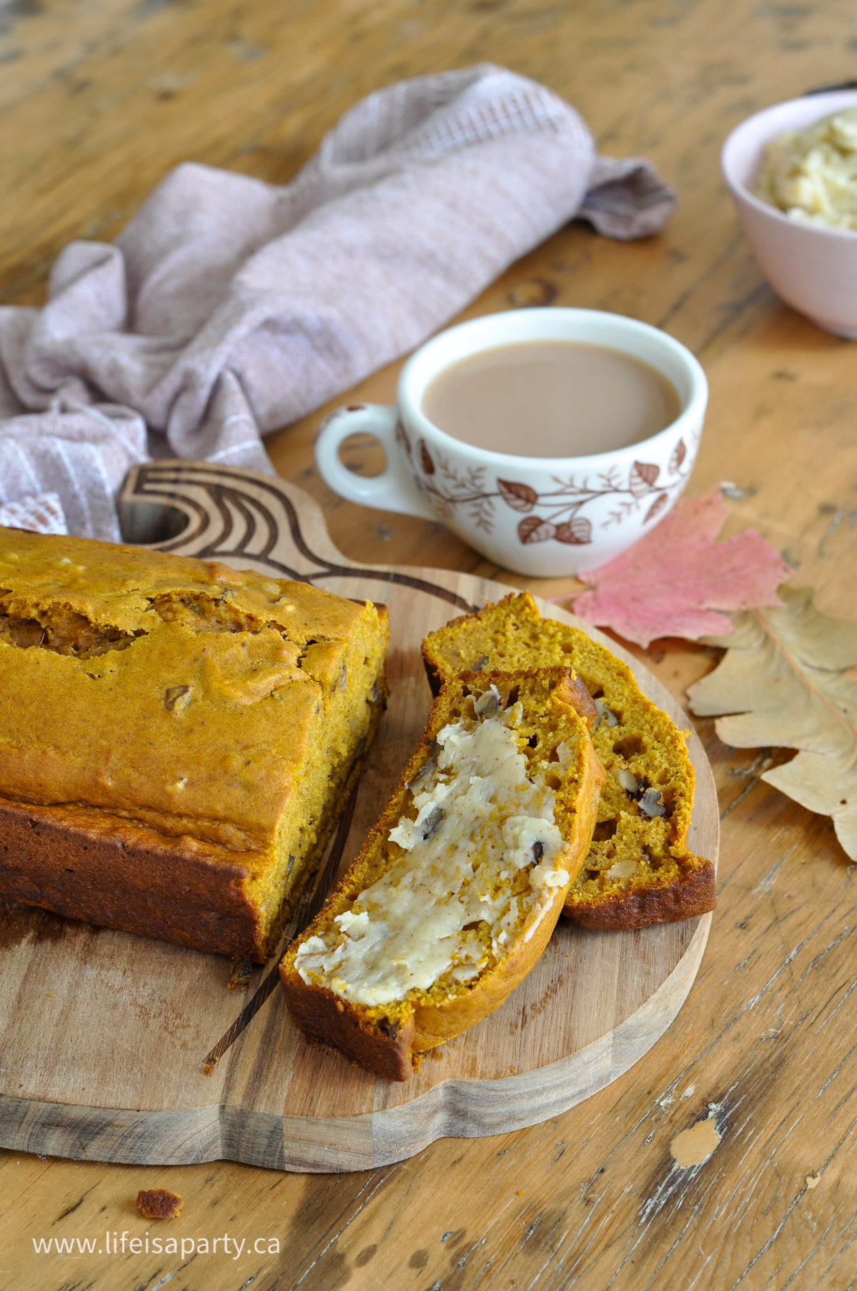 Pumpkin bread with walnuts, spread with cinnamon honey butter and a cup of tea.