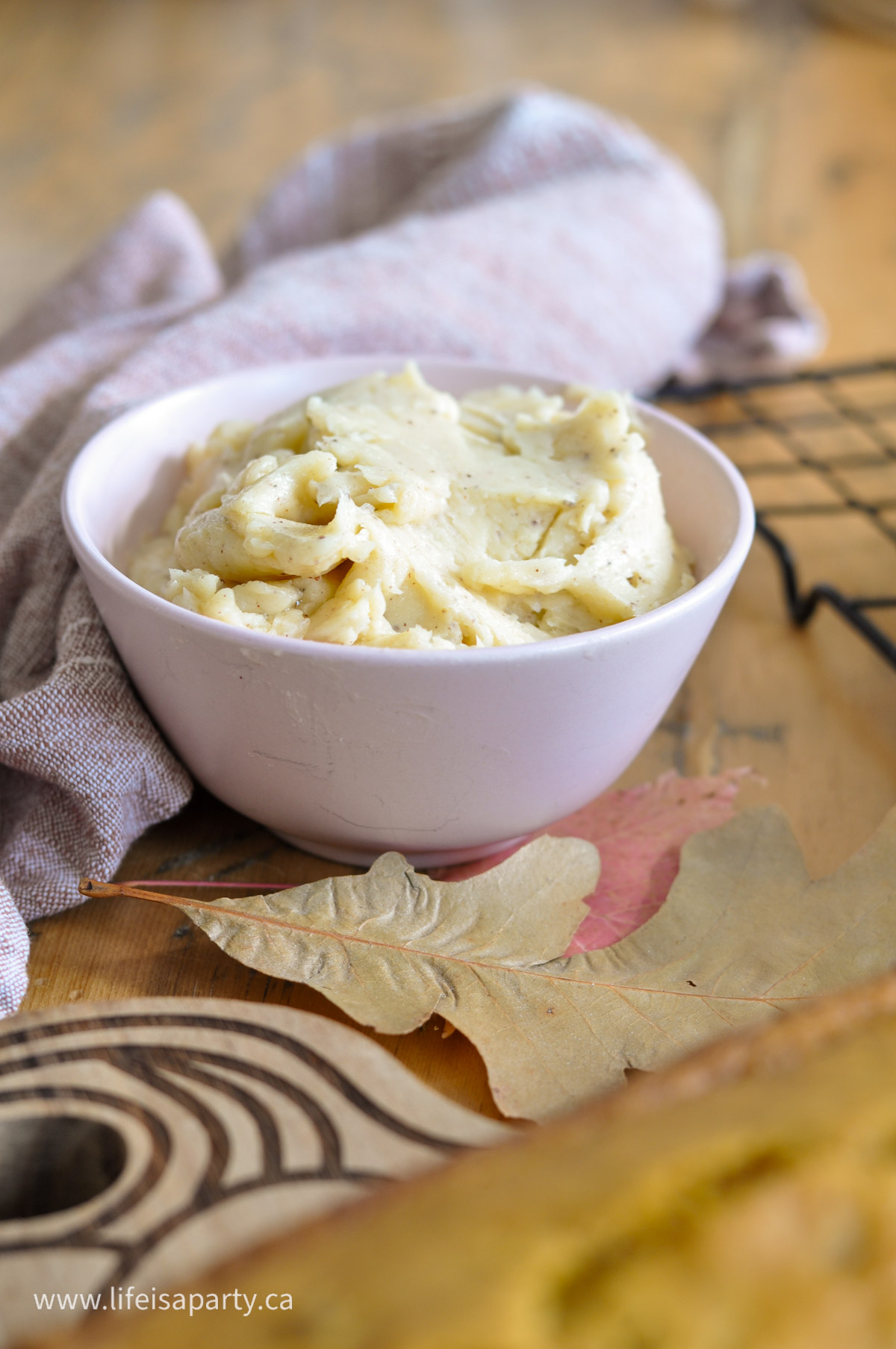 Honey cinnamon butter in a small pink bowl.