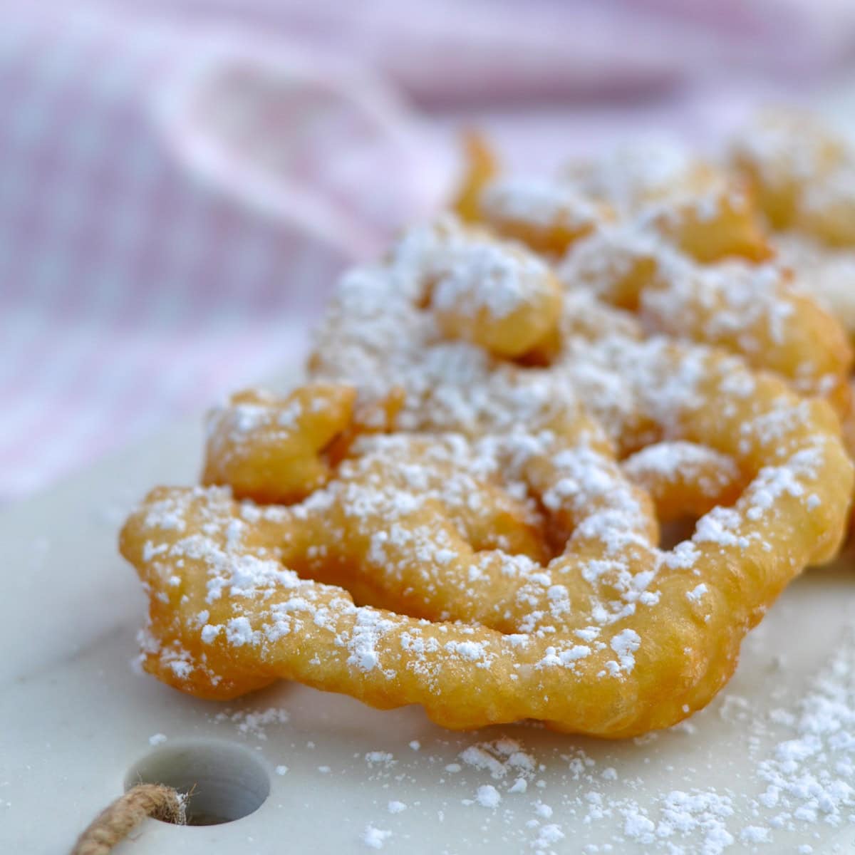 How to make homemade funnel cakes at home.