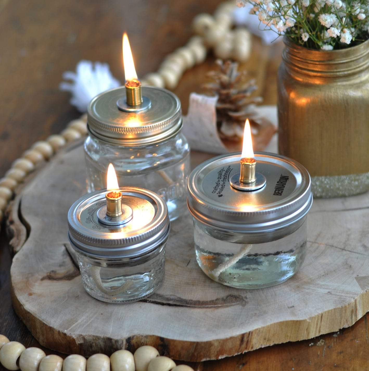 DIY Mason Jar Oil Lamps: Simple to make and so beautiful. Perfect for a party, wedding centerpiece, or just in your home.