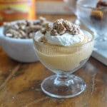 Individual pumpkin trifle in glass dessert dish.