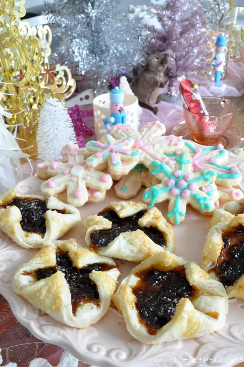 Nutcracker tea party food ideas, snowflake sugar cookies, and sugar plum tarts.