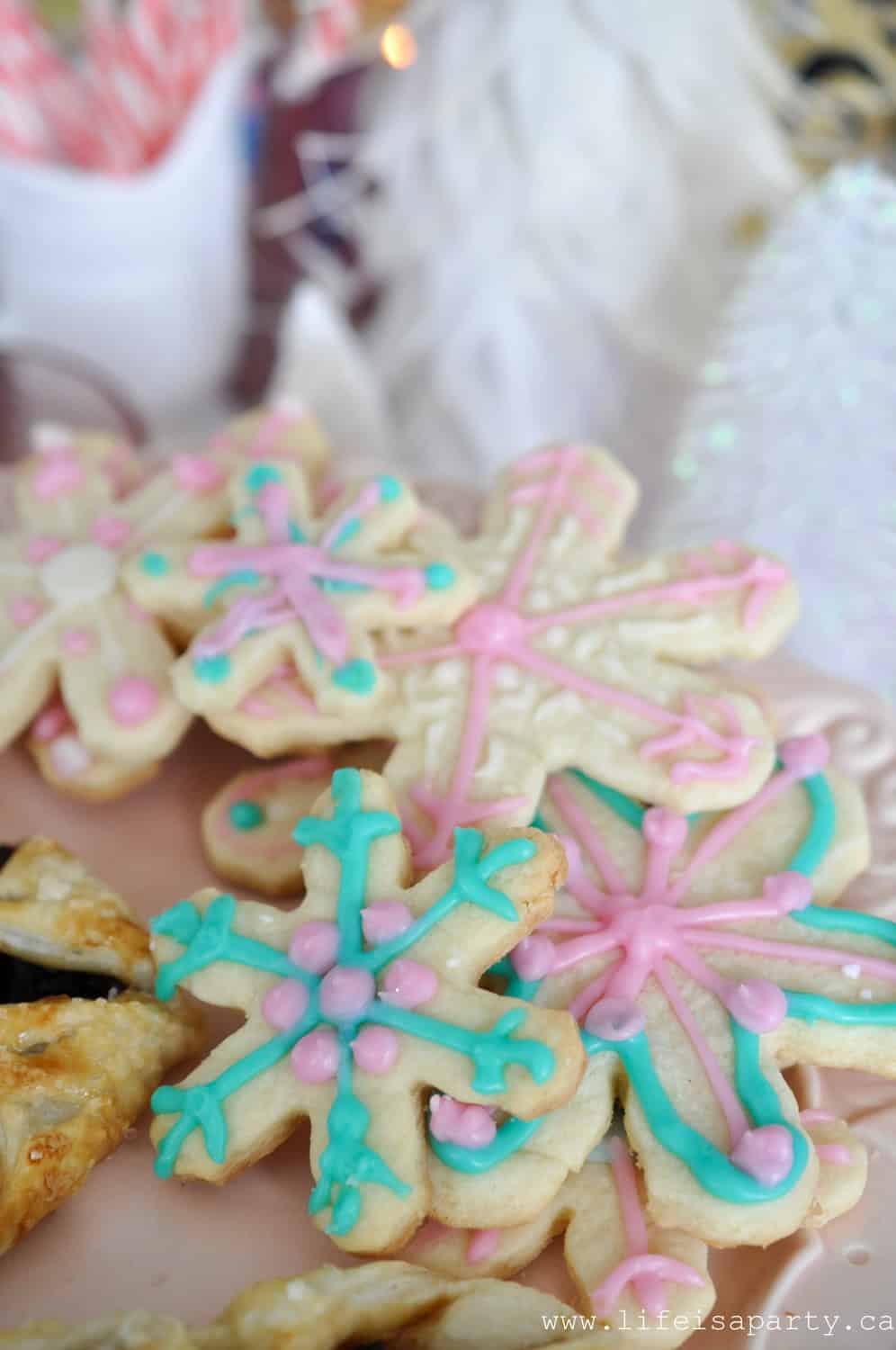 Nutcracker themed party foods snowflake sugar cookies.