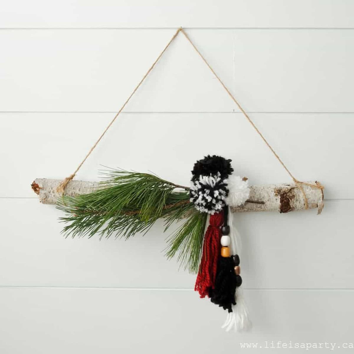 How to make a simple boho Christmas wreath with birch and tassels.