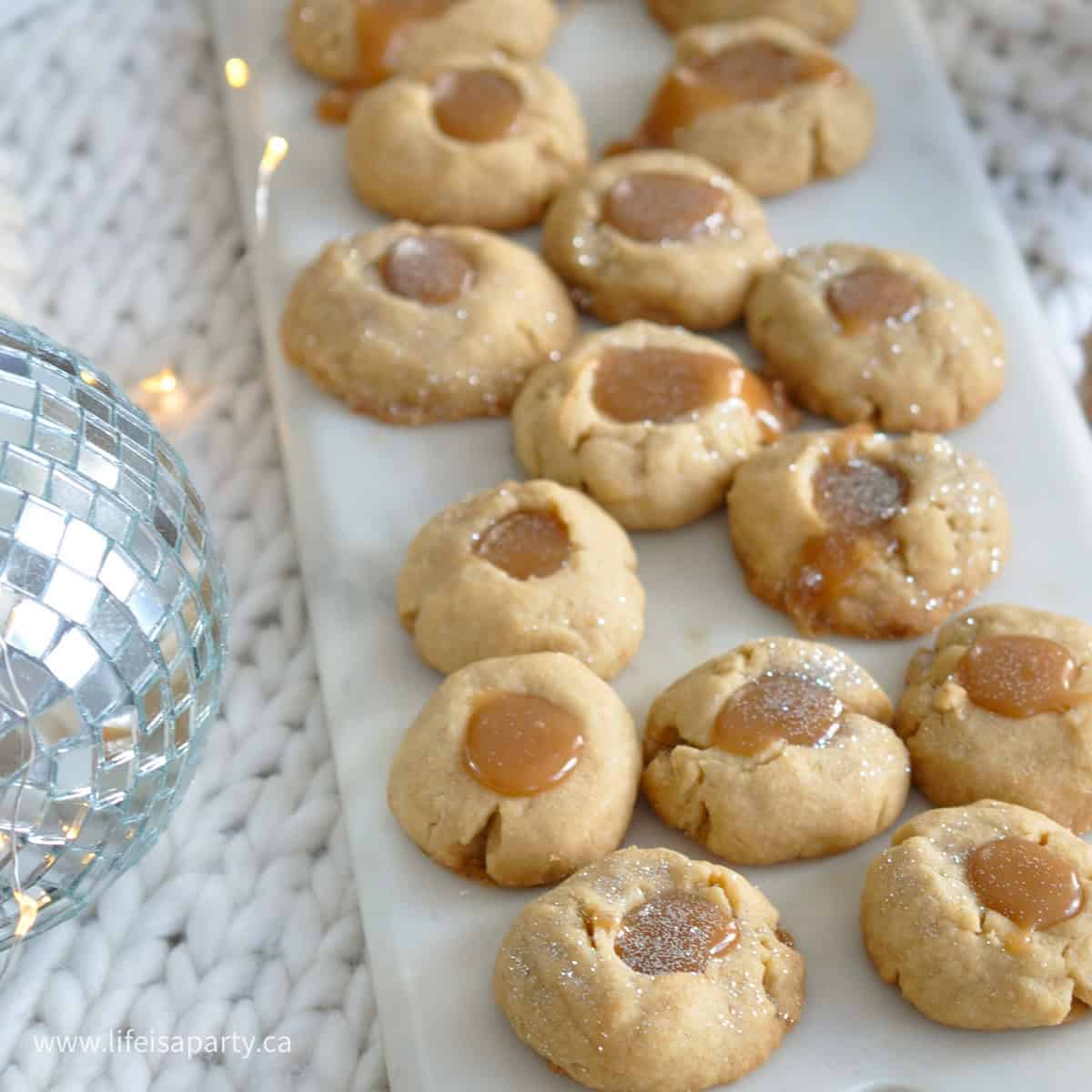 Brown sugar shortbread caramel thumbprint cookies.