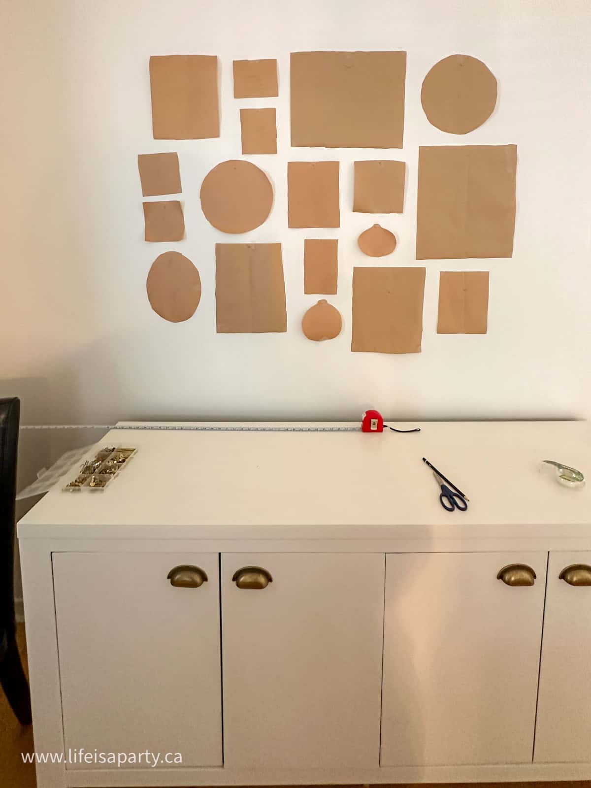 Fool proof method for hanging a gallery wall with paper templates.