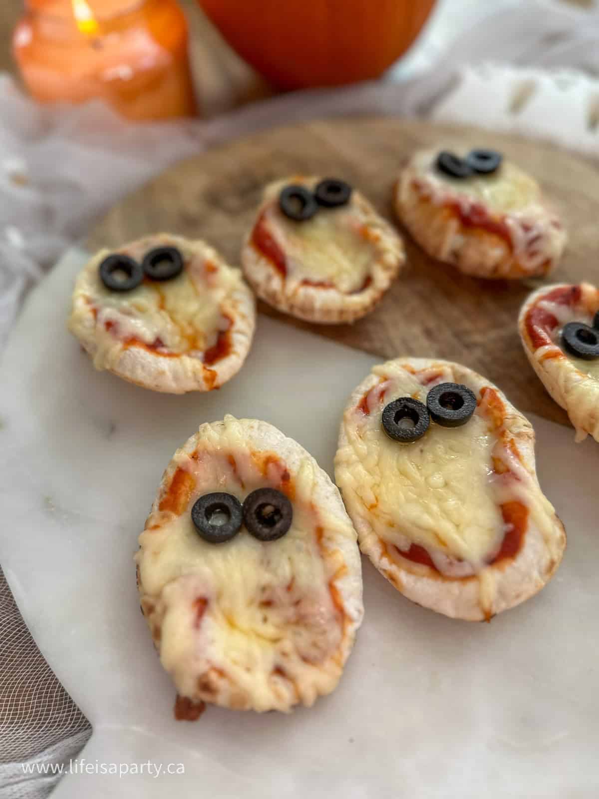 Mini ghost pizzas.