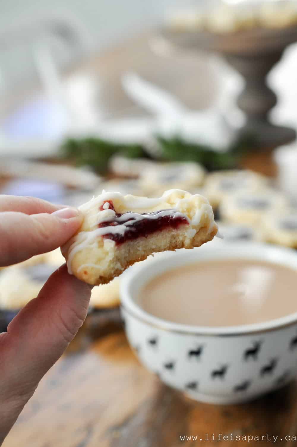 Raspberry almond thumbprint cookie with almond glaze.